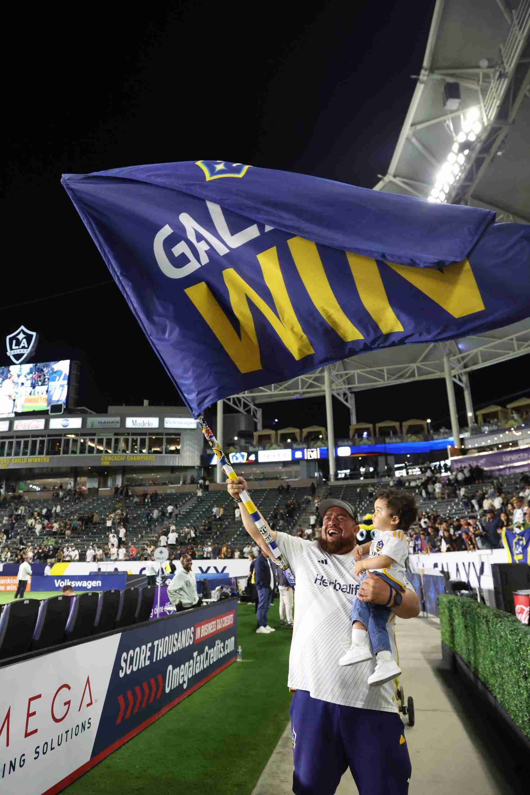 Sep 14, 2024; Carson, California, USA; Los Angeles Galaxy fans celebrate after the match against the LAFC at Dignity Health Sports Park. Mandatory Credit: Kiyoshi Mio-Imagn Images