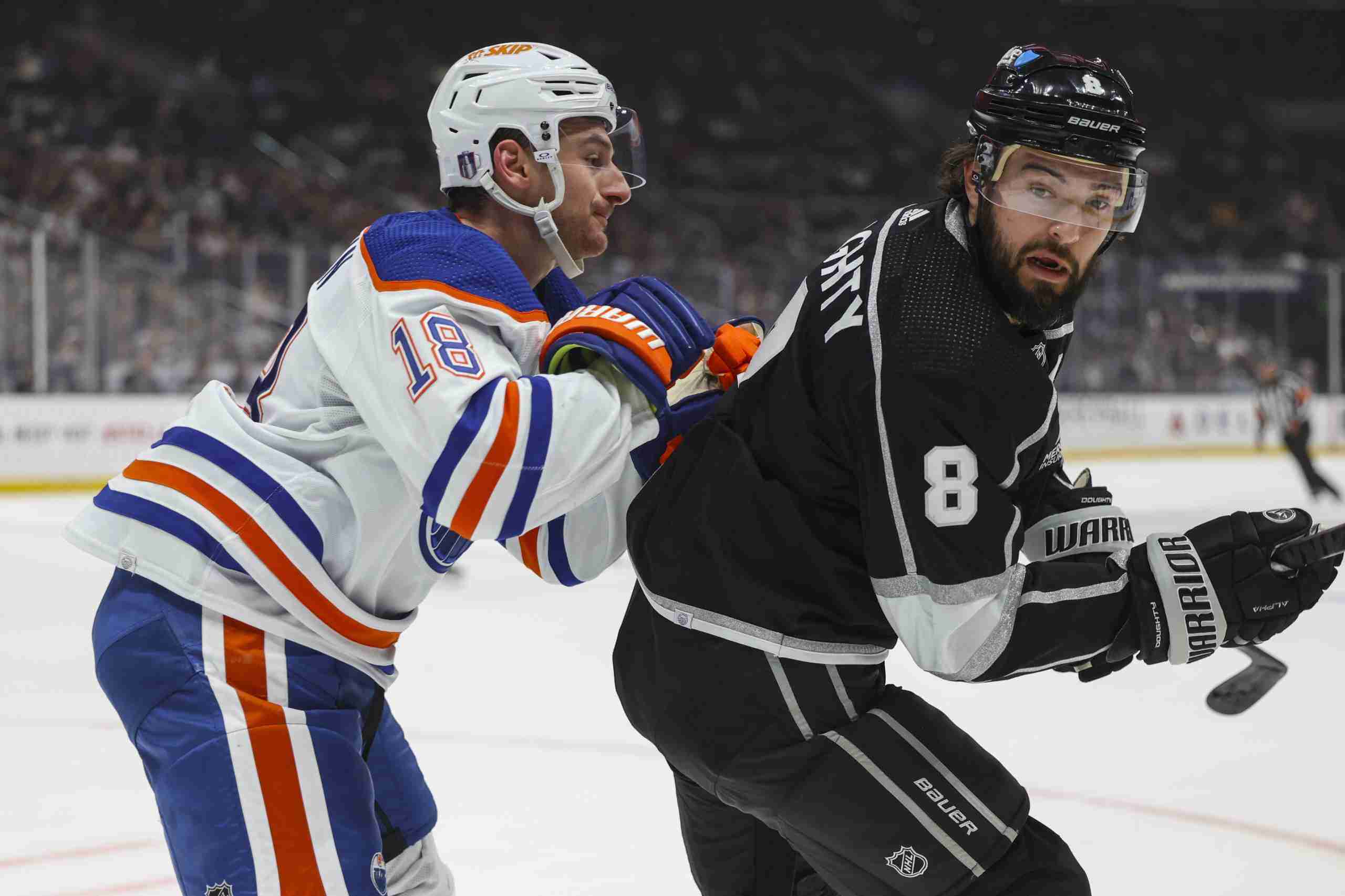 Apr 28, 2024; Los Angeles, California, USA; Edmonton Oilers left wing Zach Hyman (18) checks Los Angeles Kings defensemen Drew Doughty (8) in the first period of game four of the first round of the 2024 Stanley Cup Playoffs at Crypto.com Arena. Mandatory Credit: Yannick Peterhans-USA TODAY Sports