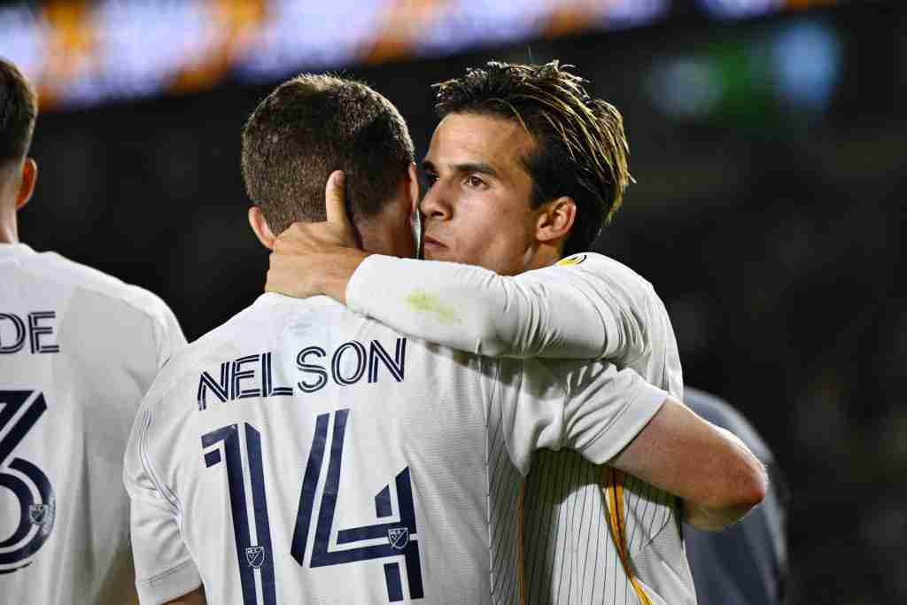 Oct 5, 2024; Carson, California, USA; LA Galaxy midfielder Riqui Puig (10) embraces defender John Nelson (14) after the match against Austin FC at Dignity Health Sports Park. Mandatory Credit: Kelvin Kuo-Imagn Images