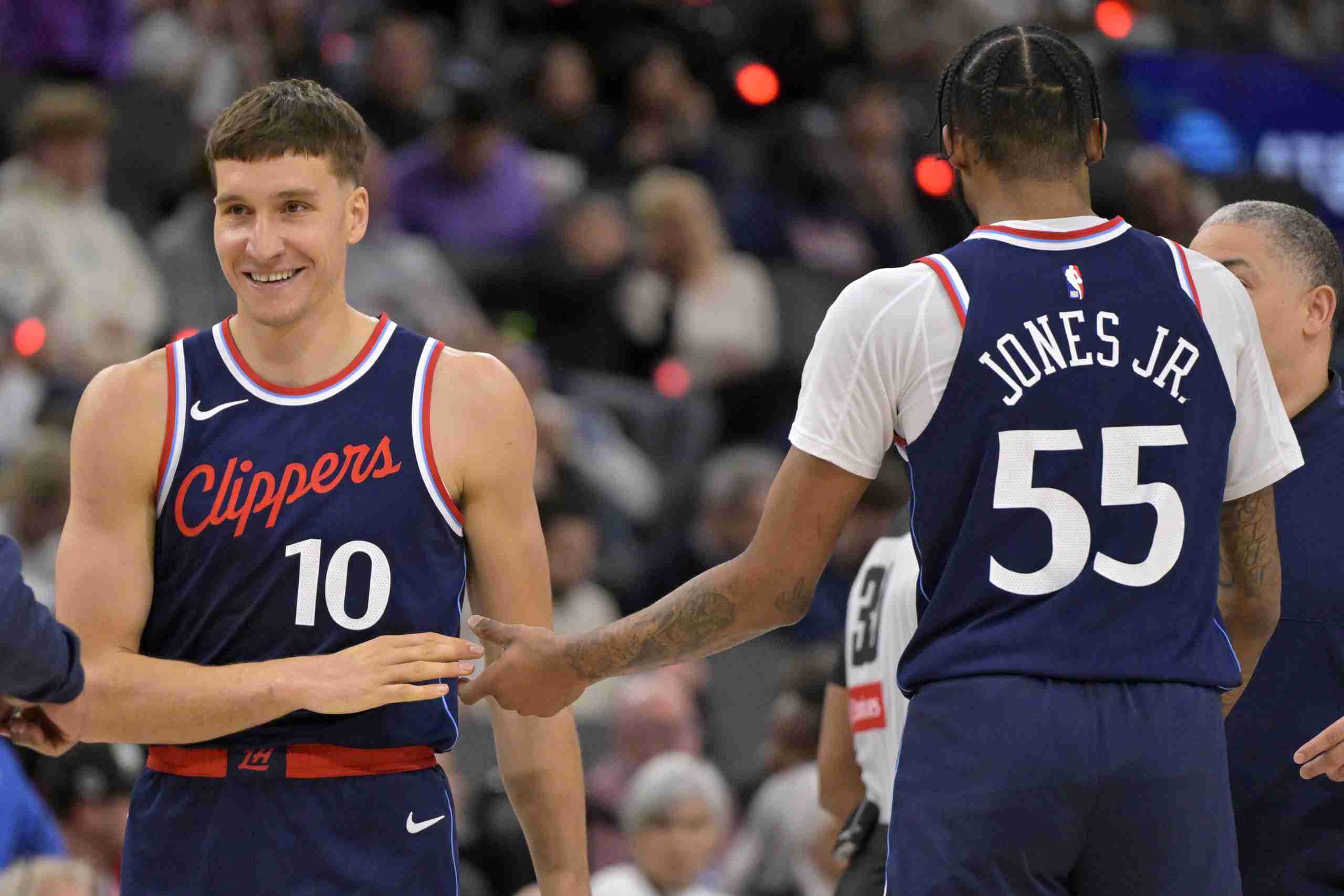 Apr 2, 2025; Inglewood, California, USA; Los Angeles Clippers guard Bogdan Bogdanovic (10) is congratulated by forward Derrick Jones Jr. (55) after a 3-point basket in the second half against the New Orleans Pelicans at Intuit Dome. Mandatory Credit: Jayne Kamin-Oncea-Imagn Images