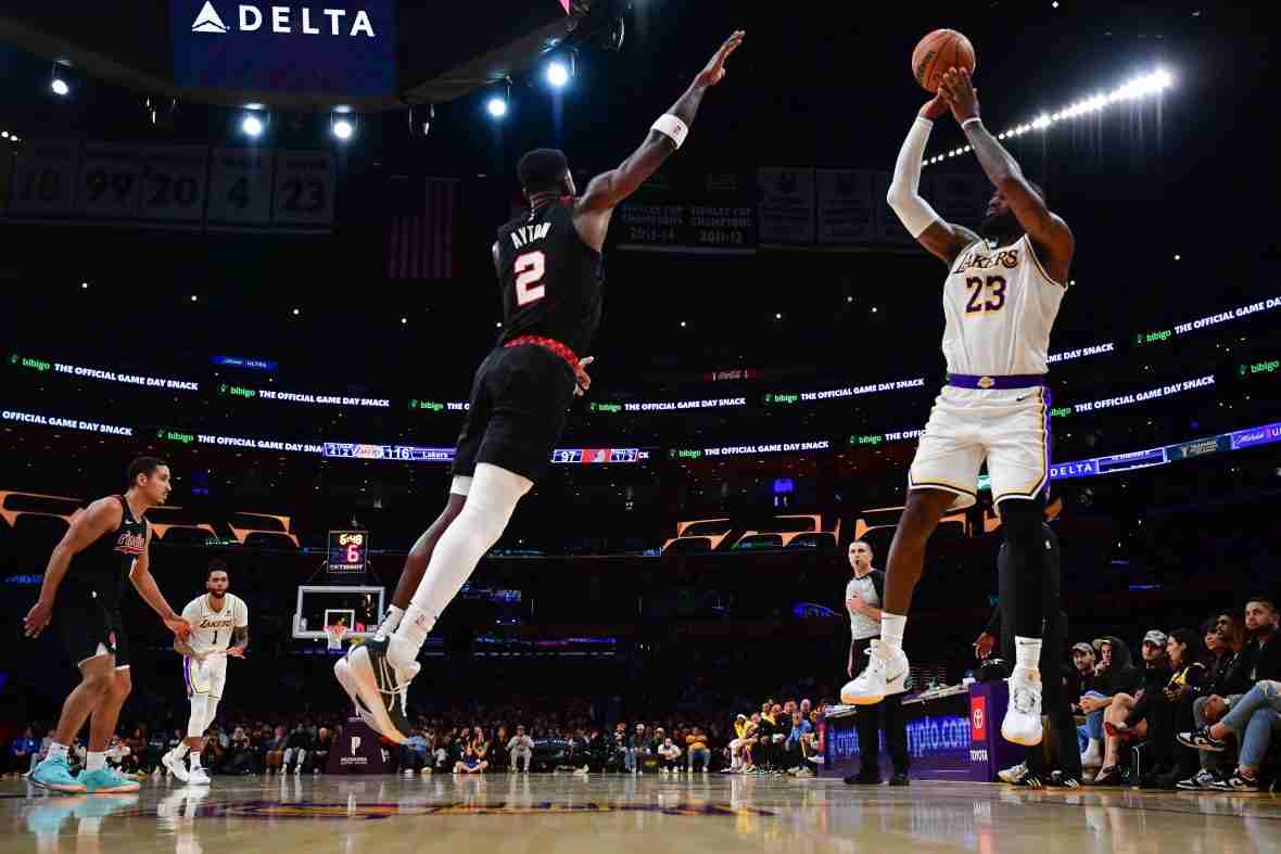 Current image: Jan 21, 2024; Los Angeles, California, USA; Los Angeles Lakers forward LeBron James (23) shoots against Portland Trail Blazers center Deandre Ayton (2) during the second half at Crypto.com Arena. Mandatory Credit: Gary A. Vasquez-USA TODAY Sports